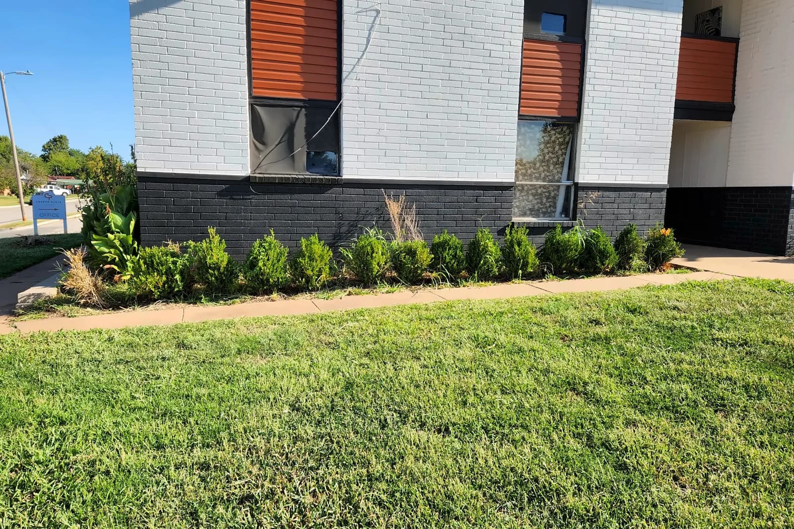 Landscaped front of Copper Place Apartments