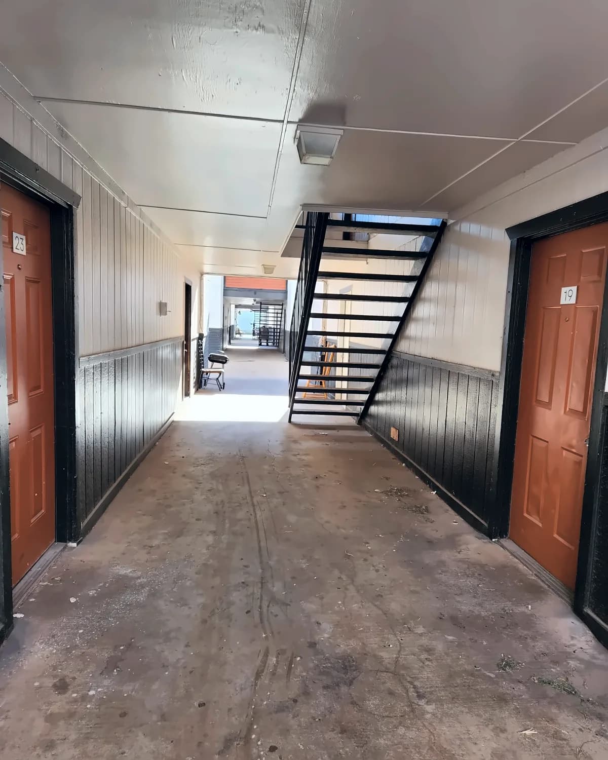 Covered breezeway with stairs at Copper Place